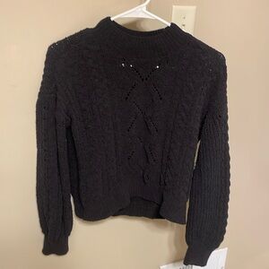 Knitted black crewneck sweater